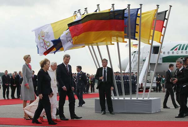 Angela Merkel wearing trousers in the presence of the Pope